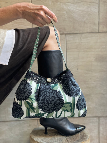 Borsa media in tessuto a fiori verde e nero