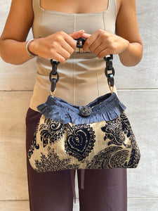 Borsa media in velluto a disegni beige e nero
