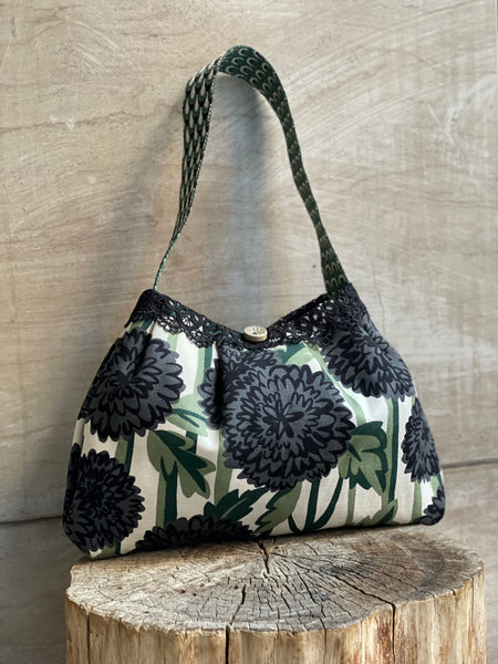 Borsa media in tessuto a fiori verde e nero