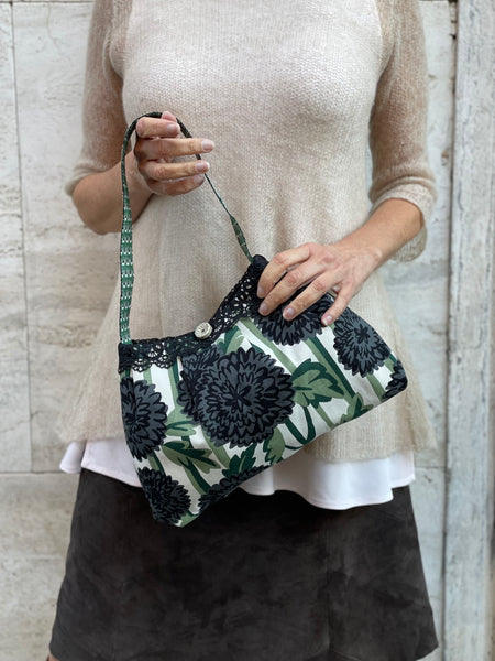 Borsa media in tessuto a fiori verde e nero