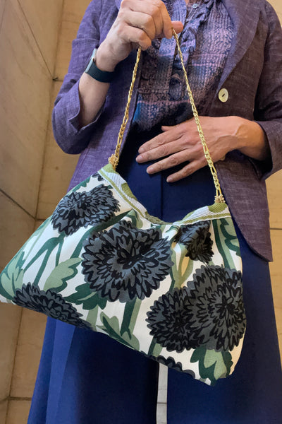 Borsa media in tessuto a fiori verde e nero