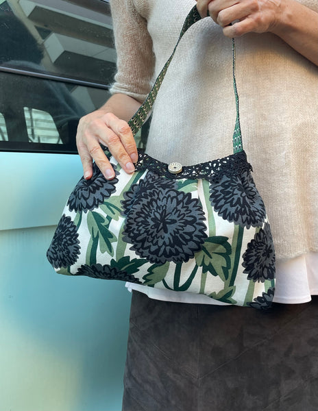 Borsa media in tessuto a fiori verde e nero