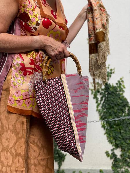 Borsa “contromano” rosso e malva