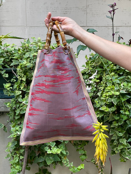 Borsa “contromano” rosso e malva