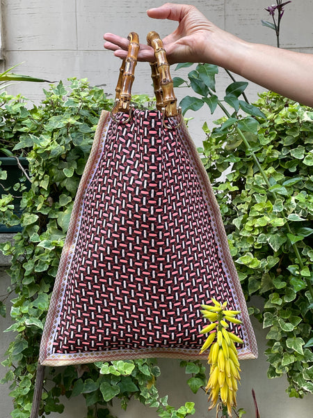 Borsa “contromano” rosso e malva