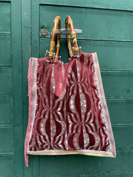 Borsa “contromano” rosa e mattone con frange rosa antico